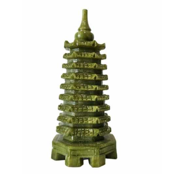 A small green pagoda sculpture with multiple tiers, each with a curved roof, and a pointed top. The base is hexagonal.
