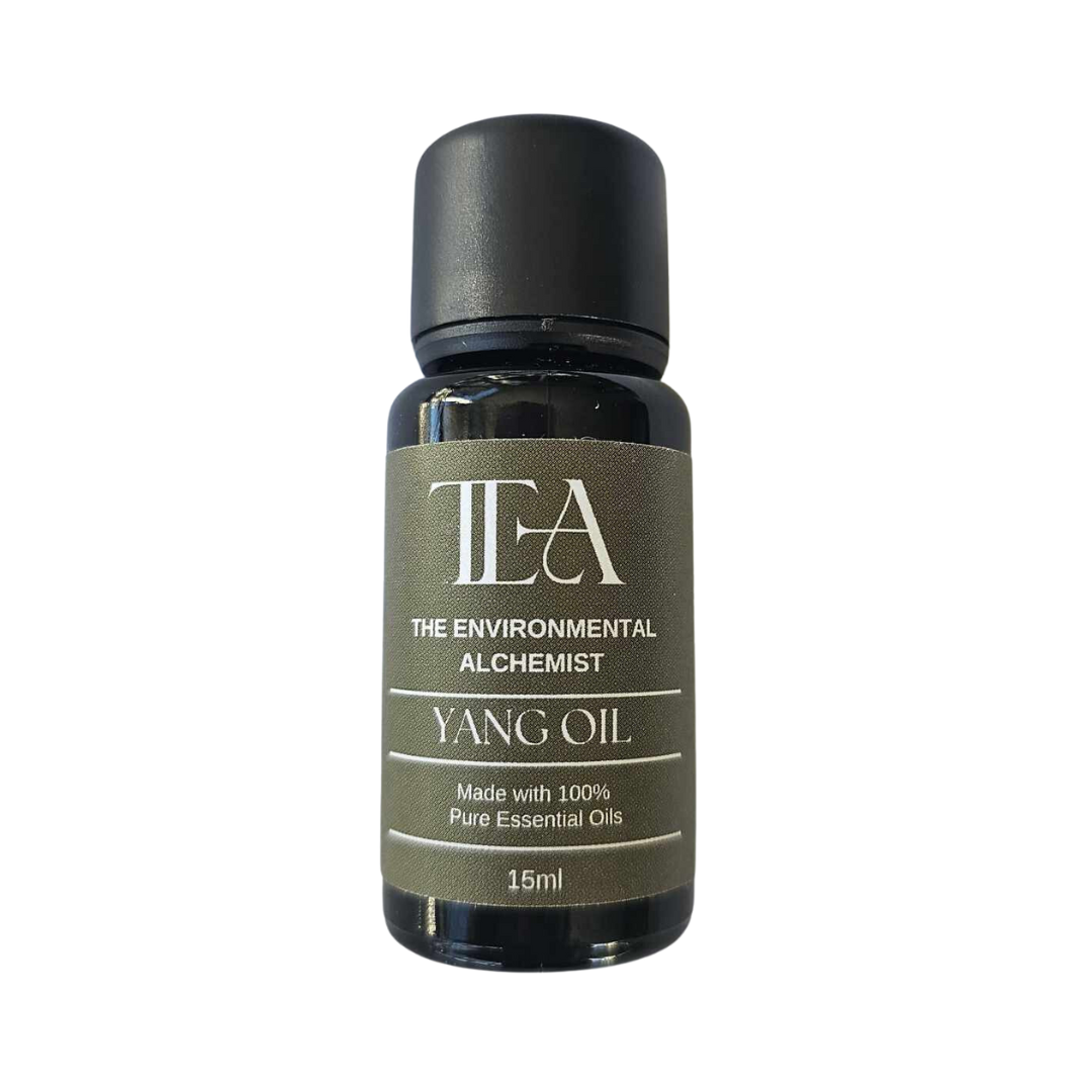 This is an image of a bottle labeled "TEA THE ENVIRONMENTAL ALCHEMIST YANG OIL." It states that it is made with 100% pure essential oils and has a volume of 15ml.