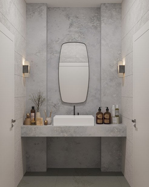 3D render of a bathroom with a grey stone vanity and a rounded mirror